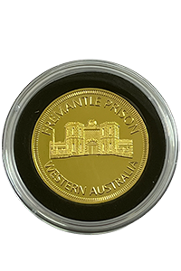 Gold plated souvenir coin featuring Fremantle Prison logo and embossing in display case