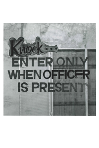 Black and white square photographic postcard of sign saying Knock. Enter only when officer is present